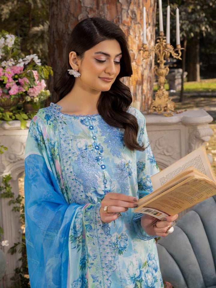 NAMAL 3 Pieces Unstitched Digital Printed Lawn Suit featuring a digital printed lawn shirt with organza embroidery, dyed cambric cotton trousers, and a bamber chiffon dupatta with embroidered cut-work details.