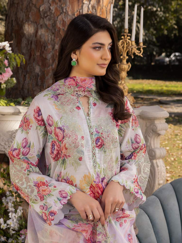 NAMAL 3 Pieces Unstitched Digital Printed Lawn Suit featuring a digital printed lawn shirt with organza embroidery, dyed cambric cotton trousers, and a bamber chiffon dupatta with embroidered cut-work details.