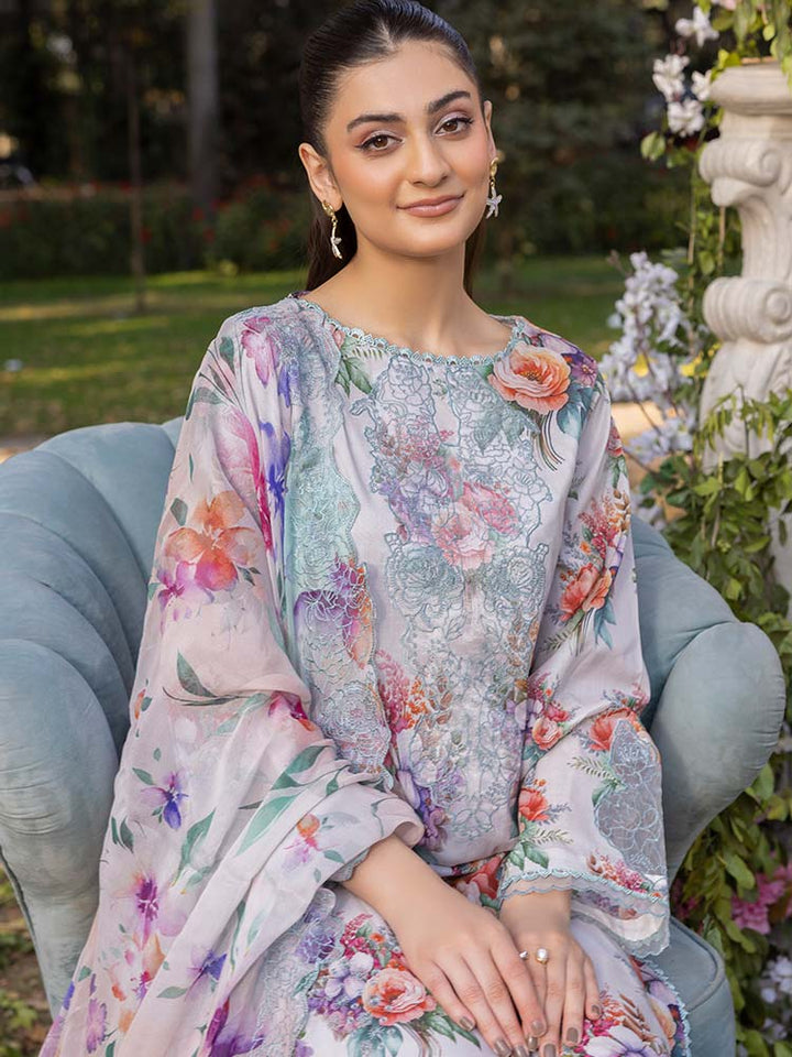 NAMAL 3 Pieces Unstitched Digital Printed Lawn Suit featuring a digital printed lawn shirt with organza embroidery, dyed cambric cotton trousers, and a bamber chiffon dupatta with embroidered cut-work details.