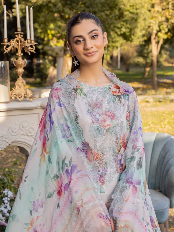 NAMAL 3 Pieces Unstitched Digital Printed Lawn Suit featuring a digital printed lawn shirt with organza embroidery, dyed cambric cotton trousers, and a bamber chiffon dupatta with embroidered cut-work details.