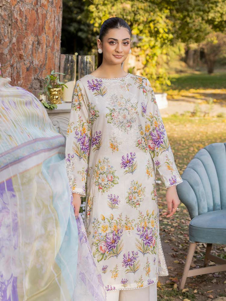 NAMAL 3 Pieces Unstitched Digital Printed Lawn Suit featuring a digital printed lawn shirt with organza embroidery, dyed cambric cotton trousers, and a bamber chiffon dupatta with embroidered cut-work details.