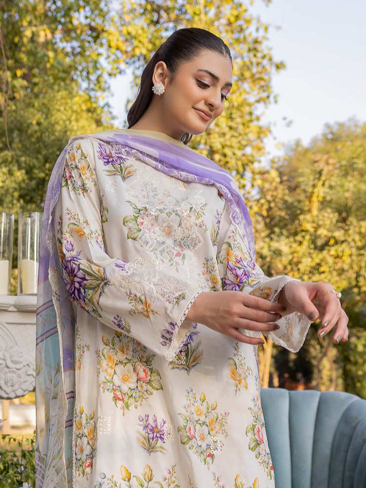 NAMAL 3 Pieces Unstitched Digital Printed Lawn Suit featuring a digital printed lawn shirt with organza embroidery, dyed cambric cotton trousers, and a bamber chiffon dupatta with embroidered cut-work details.