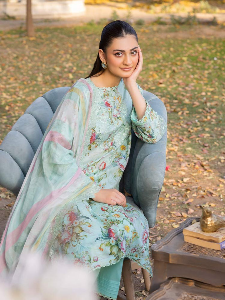 NAMAL 3 Pieces Unstitched Digital Printed Lawn Suit featuring a digital printed lawn shirt with organza embroidery, dyed cambric cotton trousers, and a bamber chiffon dupatta with embroidered cut-work details.
