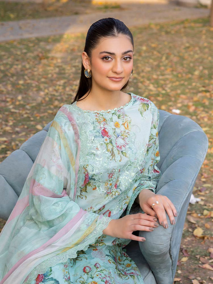 NAMAL 3 Pieces Unstitched Digital Printed Lawn Suit featuring a digital printed lawn shirt with organza embroidery, dyed cambric cotton trousers, and a bamber chiffon dupatta with embroidered cut-work details.